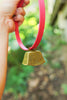 Collier cloche bronze